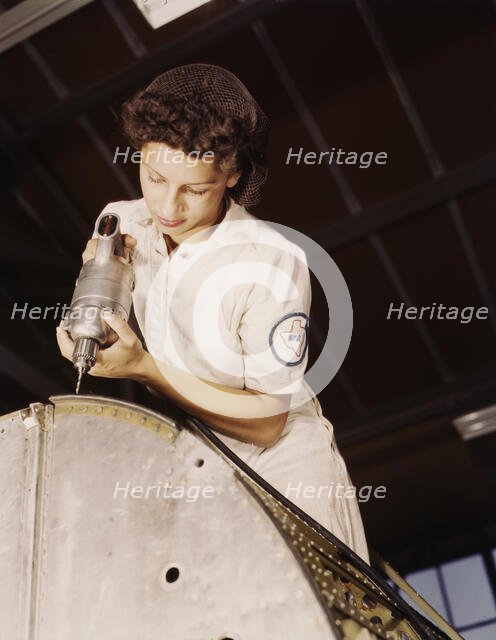 A rivet is her fighting weapon..., Naval Air Base, Corpus Christi, Texas, 1942. Creator: Howard Hollem.