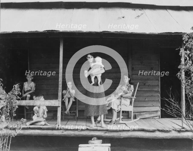 Cotton sharecropper family, Macon County, Georgia, 1937. Creator: Dorothea Lange.