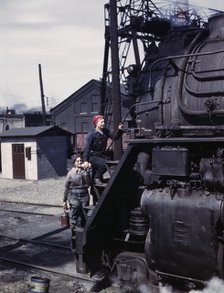 Women wipers of the Chicago and North Western Railroad cleaning one of the..., Clinton, Iowa, 1943. Creator: Jack Delano.
