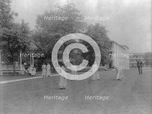 Women student activities - playing croquet, Carlisle Indian School, Carlisle, Pennsylvania, 1901. Creator: Frances Benjamin Johnston.