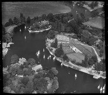 Sailing boats on the River Thames and Weybridge Tennis Club, Weybridge, Surrey, 1959.  Creator: Aerofilms.
