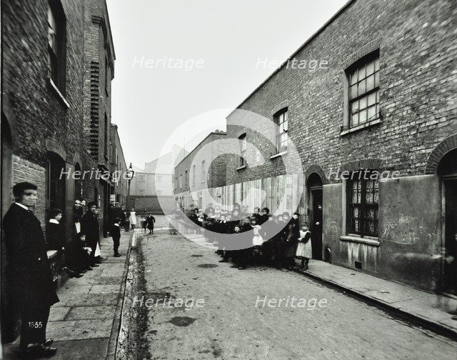 People outside boarded-up houses in Ainstey Street, Bermondsey, London, 1903. Artist: Unknown.