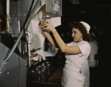 Transfusion donor bottles, Baxter Lab., Glenview, Ill., 1942. Creator: Howard Hollem.