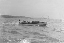 Modwena's motor launch with Modwena in the background, 1911. Creator: Kirk & Sons of Cowes.
