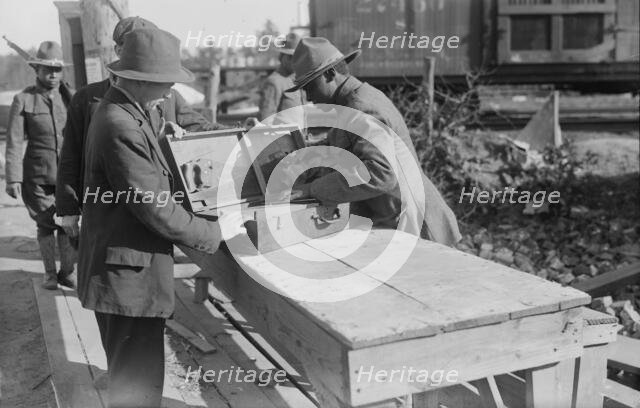 Yaphank, examining packages, 11 Sept 1917. Creator: Bain News Service.