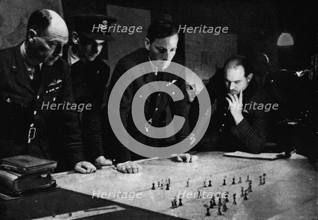 RAF Bomber Command operations room during a raid, 1941. Artist: Unknown.