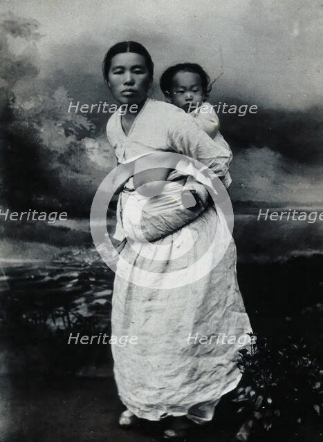 A Korean (?) woman, carrying a baby on her back, approx 1900. Creator: Unknown.