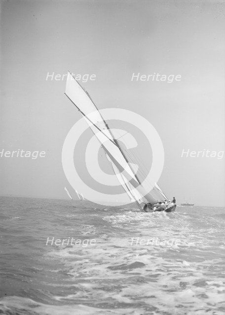 The gaff rigged cutter 'Bloodhound' sailing close-hauled, leaves wake, 1911. Creator: Kirk & Sons of Cowes.