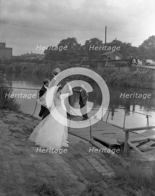Wedding couple crossing the river Don, Mexborough, South Yorkshire, 1961.  Artist: Michael Walters