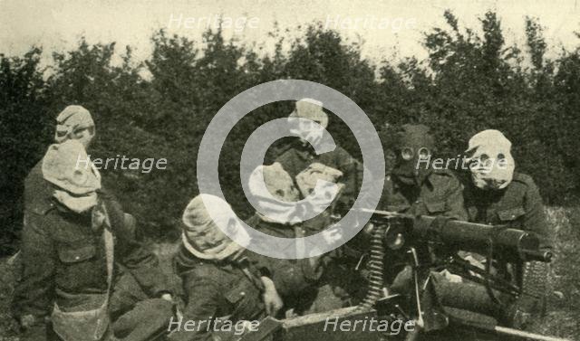 '...British Machine-gun Section wearing anti-gas masks', First World War, 1914-1918, (c1920). Creator: Unknown.