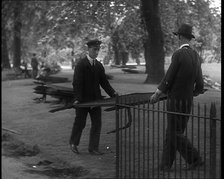 Men Removing Park Railings for Use in Factories, 1940. Creator: British Pathe Ltd.