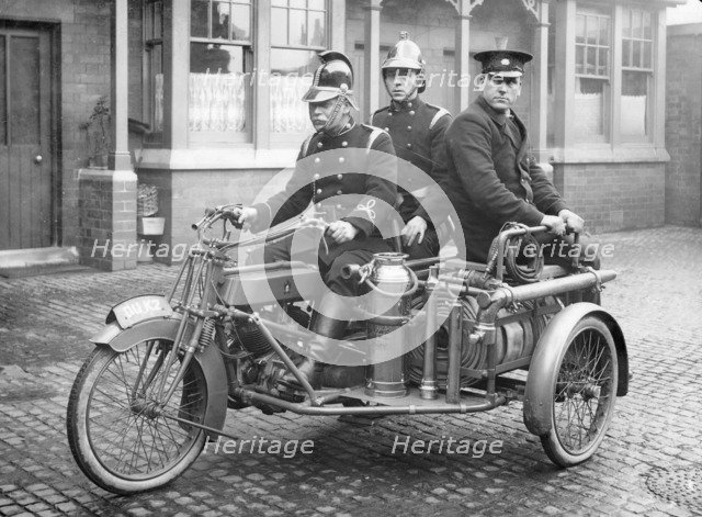 A Rex motorcycle being used by firemen. Artist: Unknown