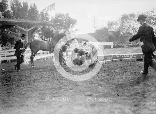 Horse Shows - Victor Mather Falling From 'Pagan Kin', 1912. Creator: Harris & Ewing.