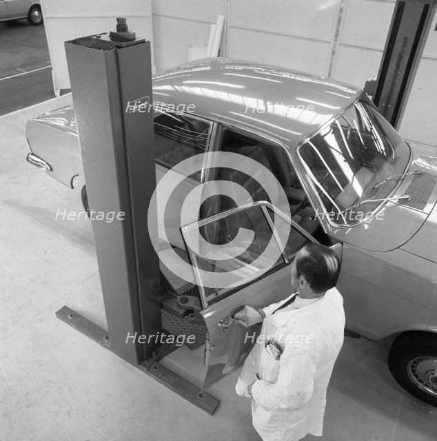 Ford Zodiac on an assymetric lift, Sheffield, South Yorkshire, 1972. Artist: Michael Walters