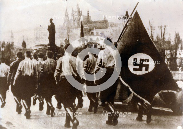German troops enter Prague over the Charles Bridge, 15th March 1939. Artist: Unknown