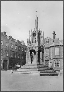 The Market Cross seen from the west, Market Square, Leighton Buzzard, Bedfordshire, 1910-1960. Creator: George R Long.