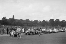 Drivers running to their cars at the start of the Imperial Trophy race, Crystal Palace, 1939. Artist: Bill Brunell.