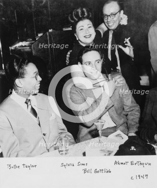 Portrait of Billy Taylor, Sylvia Syms, William P. Gottlieb, and Ahmet M. Ertegun, N.Y., ca. 1947. Creator: Delia Potofsky Gottlieb.