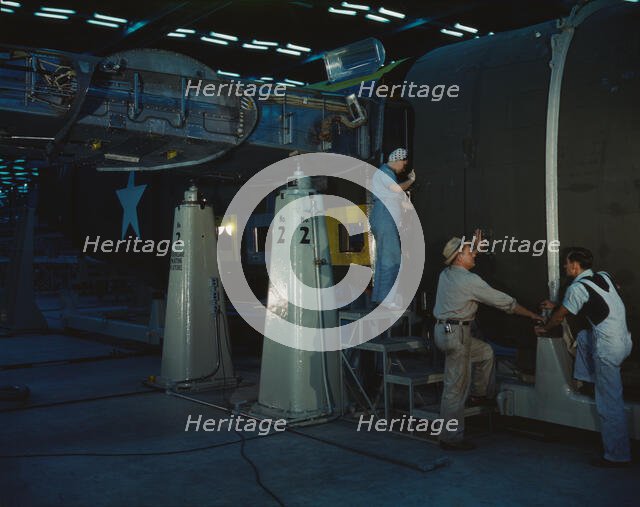 Assembling Liberator Bomber, Consolidated Aircraft Corp., Fort Worth, Texas, 1942. Creator: Howard Hollem.