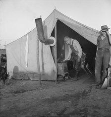 In a carrot pullers' camp near Holtville, California, 1939. Creator: Dorothea Lange.