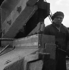Scrapyard worker, Rotherham, South Yorkshire, 1963. Artist: Michael Walters