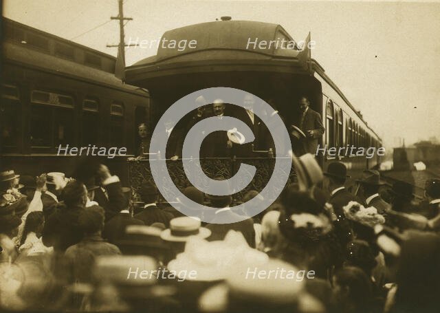 Russian diplomats waving at crowds from the back of a train car, 1905. Creator: Unknown.