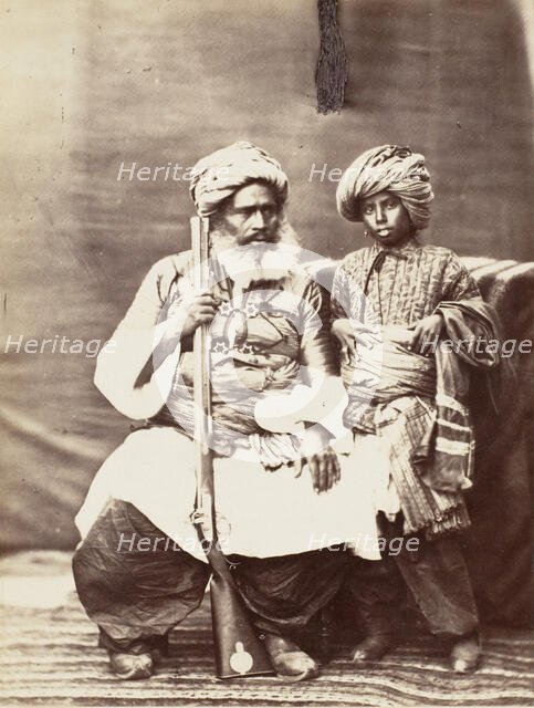 Turbaned Man Holding Rifle with Boy Alongside, 1860s. Creator: Unknown.