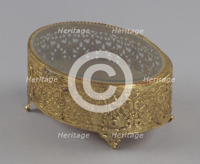 Gold metal scrollwork jewelry box from Mae's Millinery Shop, 1941-1994. Creator: Unknown.