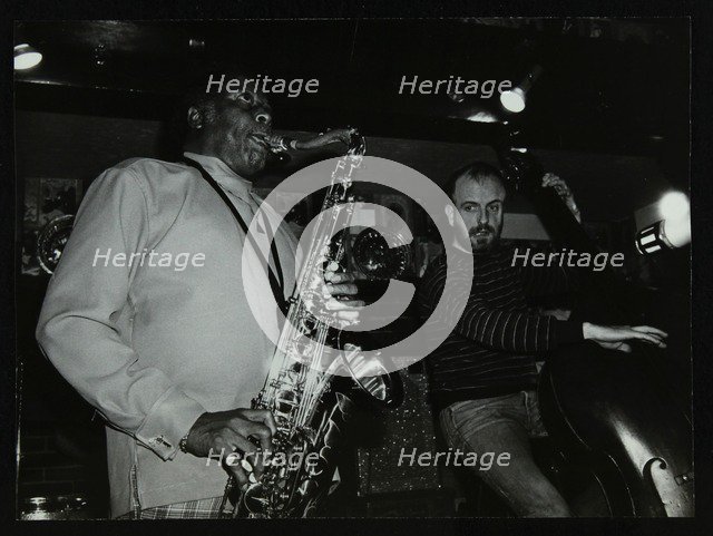 Eddie 'Lockjaw' Davis and Jim Richardson playing at The Bell, Codicote, Hertfordshire, 1982. Artist: Denis Williams