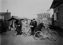 Cyclists in the courtyard of the estate, 1900. Creators: V. I. Podgorbunskii, I. A. Podgorbunskii.