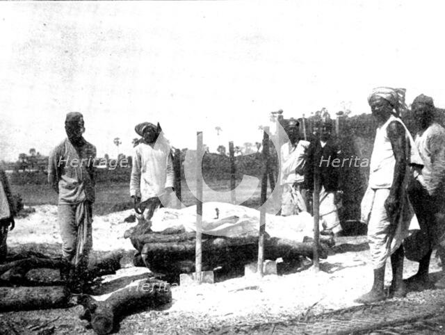 Scenes in Plague-Stricken Bombay: body lying on the pyre..., 1898. Creator: Gysi.