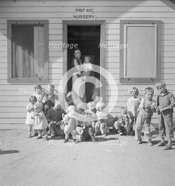 While the mothers are working in the fields, the preschool children..., Kern migrant camp, 1936. Creator: Dorothea Lange.
