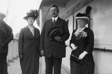 Mrs. R.A.C. Smith, Mr. R.A.C.Smith, and Mrs. J.F. Day, between c1910 and c1915. Creator: Bain News Service.