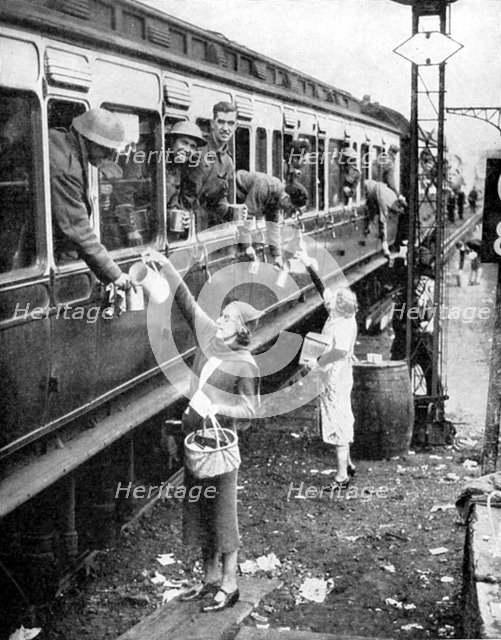 Local residents supplying refreshments to soldiers evacuated from Dunkirk, World War II, 1940. Artist: Unknown