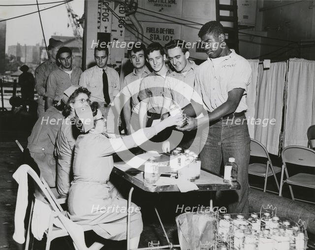 Crew members of the USS Lake Champlain (CVA-39) participating in the ship's two day..., 1950s.  Creator: United States Navy.