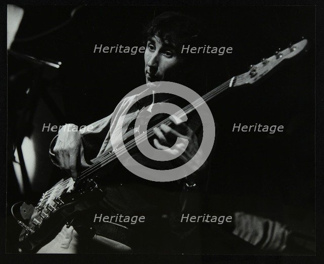 Steve Cook playing bass guitar at The Stables, Wavendon, Buckinghamshire. Artist: Denis Williams