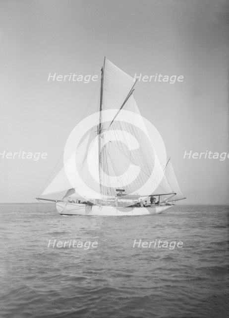 The yawl 'Suzanne' under sail, 1911. Creator: Kirk & Sons of Cowes.