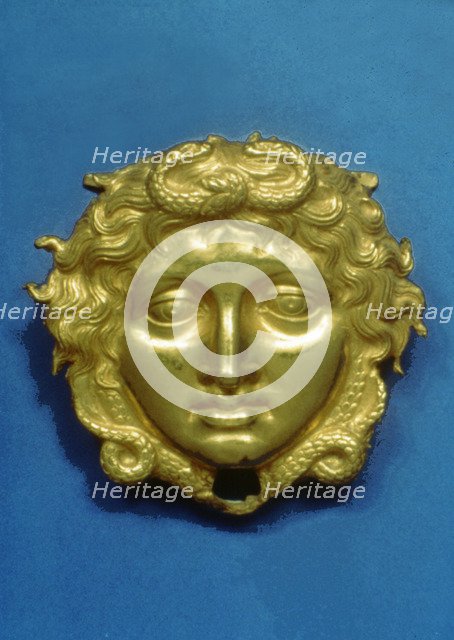 Head of the Gorgon Medusa in embossing gold, piece from the royal tomb at Vergina (350 BC).