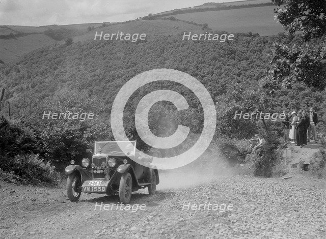 Riley 9 open 4-seater tourer at the Mid Surrey AC Barnstaple Trial, Beggars Roost, Devon, 1934. Artist: Bill Brunell.