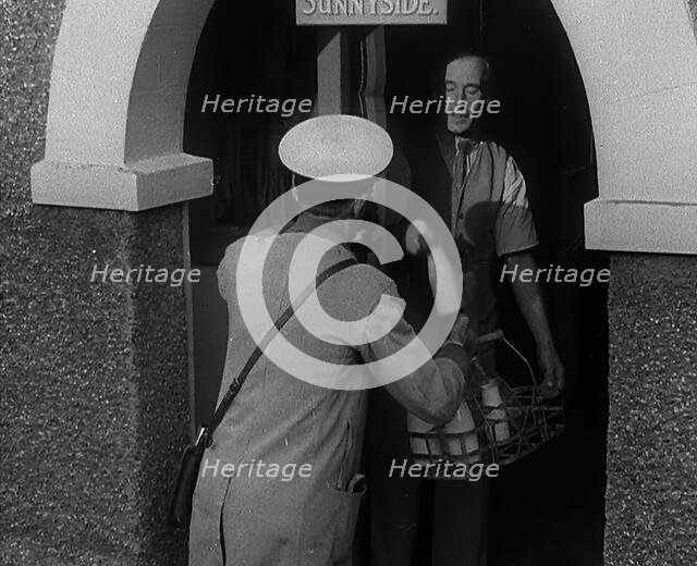 A Man Delivering Milk, 1940. Creator: British Pathe Ltd.