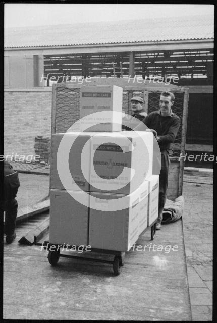 Workers moving glassware at the Wear Flint Glass Works, Alfred Street, Millfield, Sunderland, 1961. Creator: Eileen Deste.