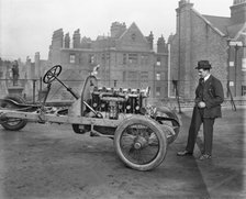 Italian racing driver Giulio Foresti with the chassis of a car, London, 1918-1919. Artist: Bedford Lemere and Company.
