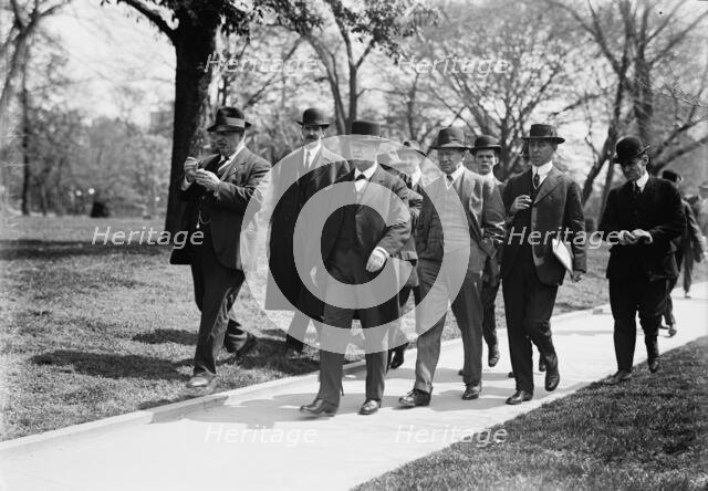 Daniels, Josephus, Secretary of The Navy, 1913-1921. with Newsmen, 1914. Creator: Harris & Ewing.