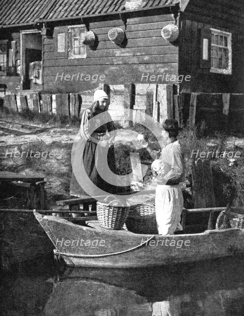 Greengrocer bringing goods by boat, Marken, Holland, 1936. Artist: Donald McLeish
