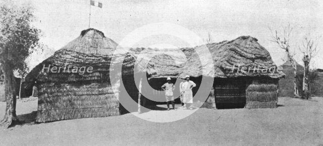 'La grande guerre en Afrique; le drapeau francais flotte sur la case du lieutenant..., c1916. Creator: Unknown.