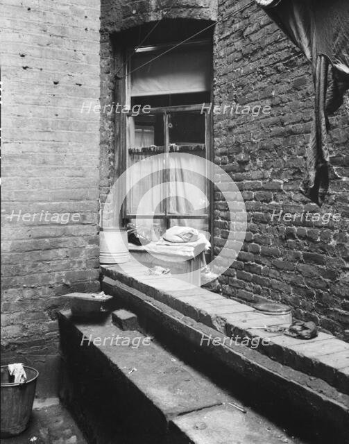 Tenement dwelling of Mr. and Mrs. Jacob Solomon, 133 Aveue D, New York City, 1936. Creator: Dorothea Lange.