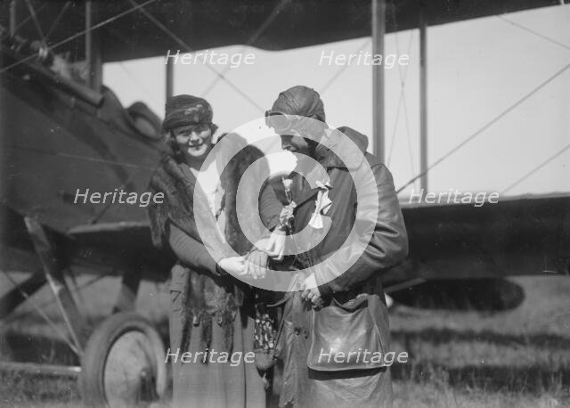 Claire Ogden, giving watch to Lieutenant W.C.F. Brown, between c1915 and c1920. Creator: Bain News Service.