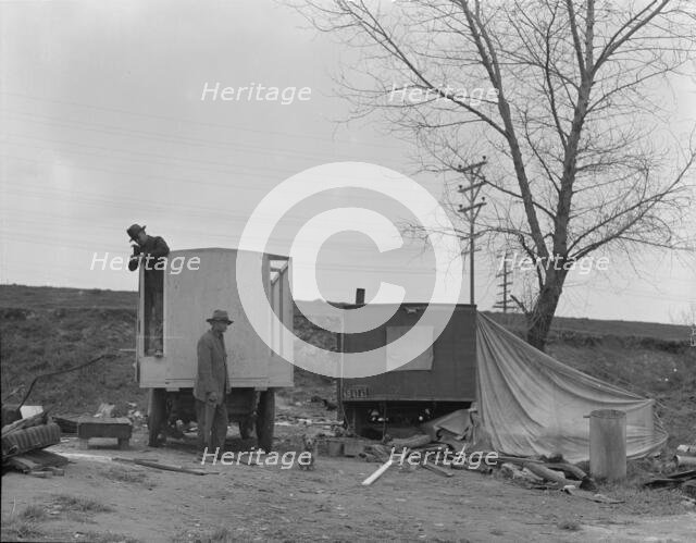 A new home on wheels (father and son), Yuba County, California, 1935. Creator: Dorothea Lange.