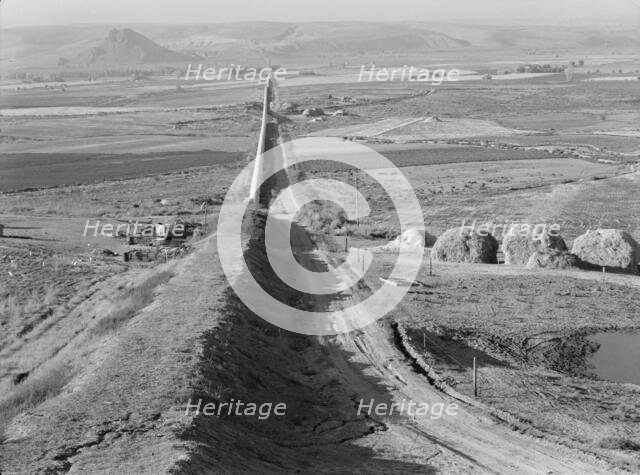 The longest siphon in the world crosses the Malheur Valley, Malheur County, Oregon, 1939. Creator: Dorothea Lange.