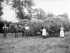 Agricultural workers pose next to loaded hay waggons near Hellidon, Northamptonshire, c1873-c1923. Artist: Alfred Newton & Sons